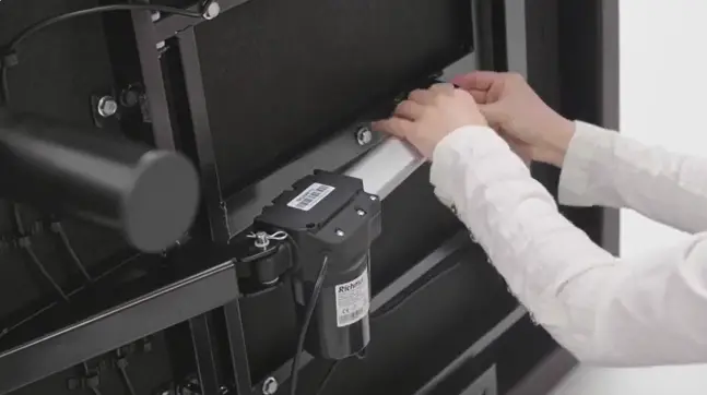 Technician working on an adjustable bed